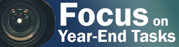 a 35 milimeter camera lens and text which reads focus on year end tasks