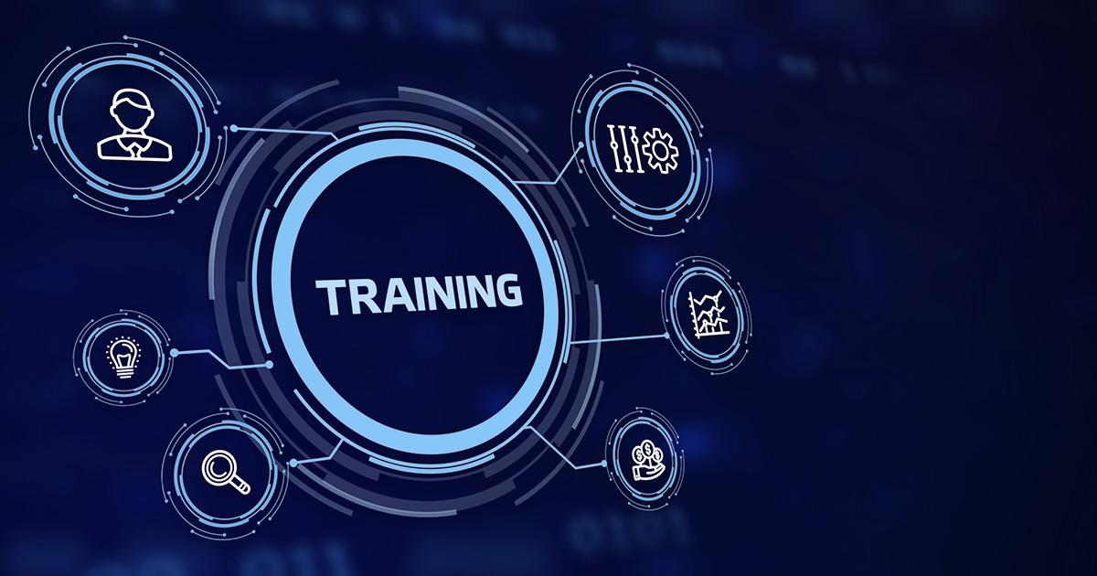 Decorative. A graphic of concentric partial circles with the word 'training' in the center. Surrounding this are smaller circles with graphic icons inside them of  a person's head and shoulders, a light bulb, a handheld magnifying glass, a hand holding coins, a graph with ascending trendlines and the final circle has pistons and a gear.