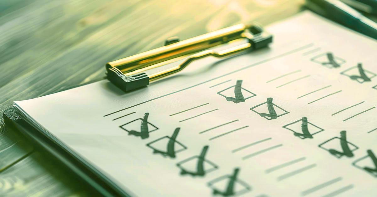 Decorative. Closeup view of a checklist on a clipboard lying on a table.