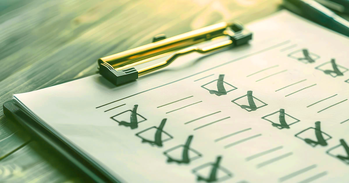 Decorative. Closeup view of a checklist on a clipboard lying on a table.