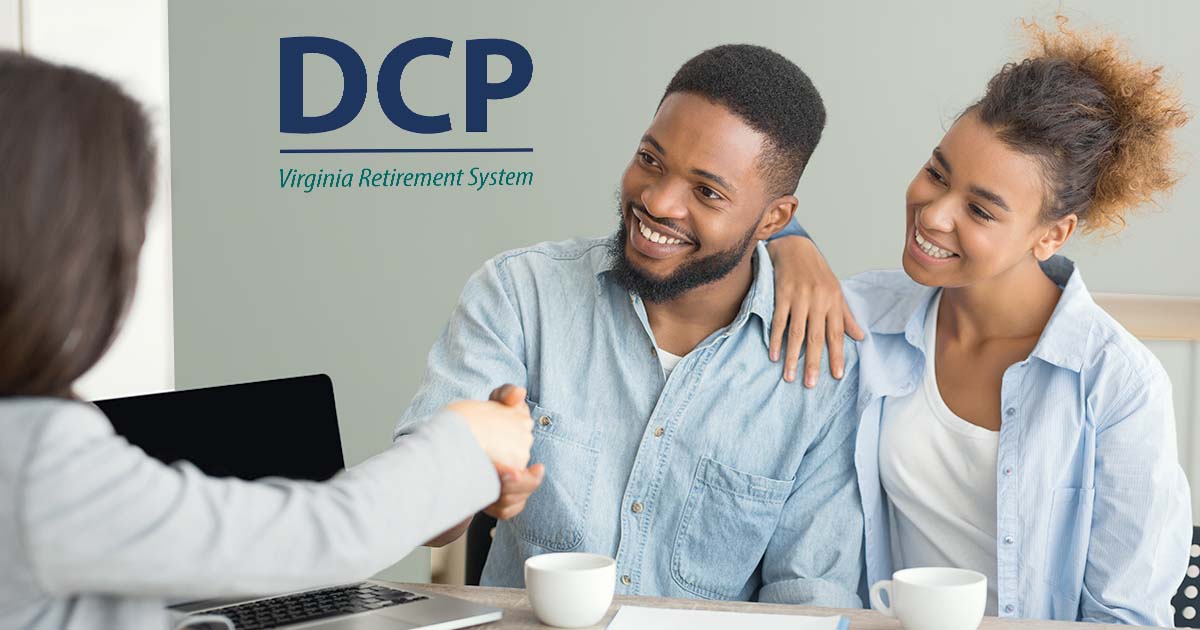 Decorative. A couple sits across from a woman at her desk. They are smiling, and the man is shaking the hand of the woman across from him. The DCP logo is on the wall above them.