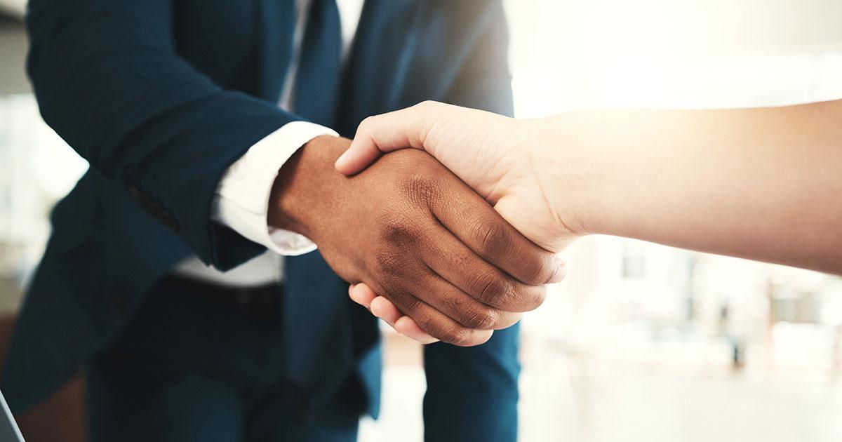Decorative. Close-up view of a man's and woman's hands engages in a handshake.