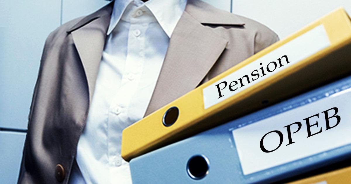 A woman's torso in professional dress in front of a tiled wall. In front of her are two three-ring binders with labels on the spines reading Pension and OPEB.