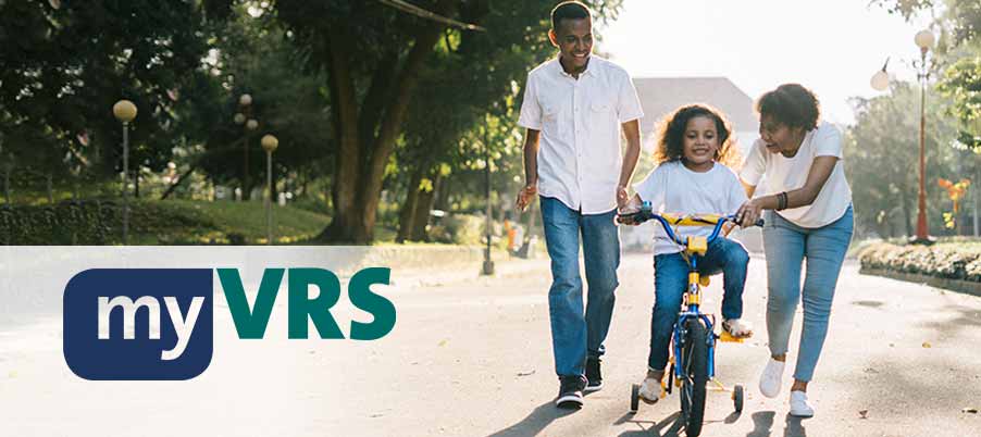 Adults helping a child ride a bike with training wheels. myVRS logo.